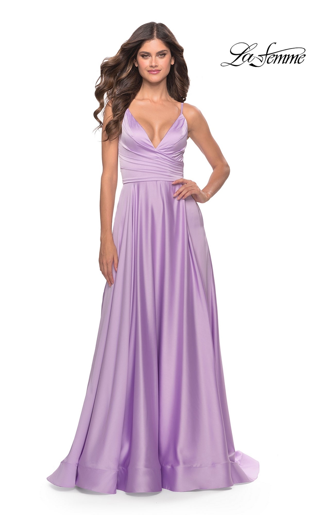 Woman in a sleeveless, floor-length lavender dress with deep V-neckline and gathered bodice stands against a white background, showcasing the elegant La Femme V-Neck Long A-Line Prom Dress 31505.
